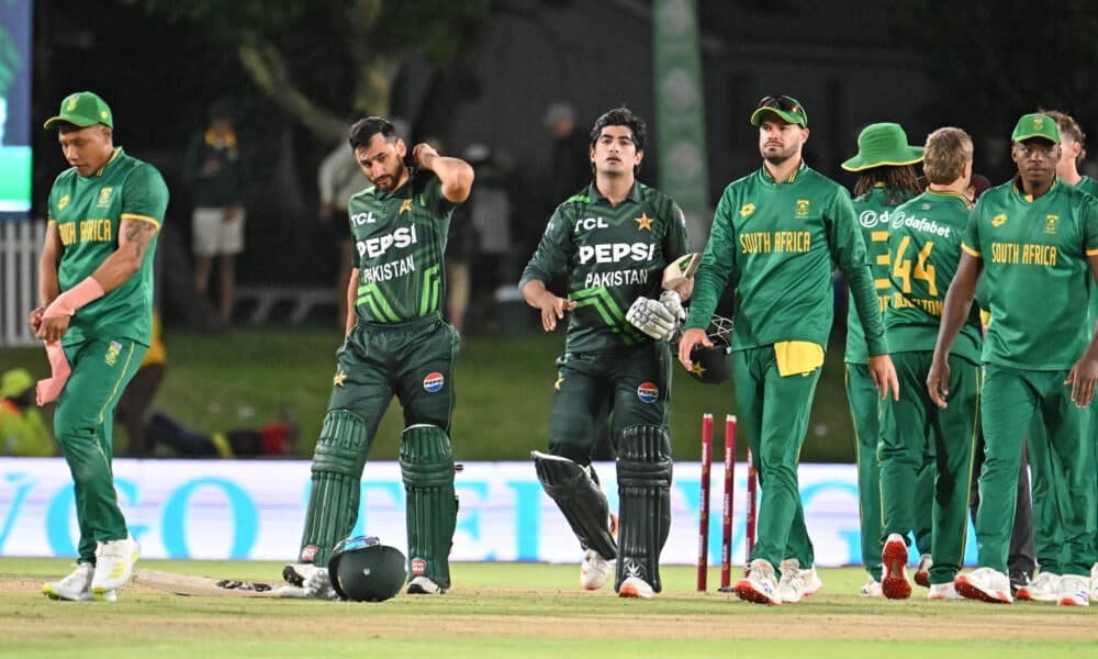 Pakistan and South Africa cricket players walking off the field after a match, showcasing a moment of sportsmanship and competition.